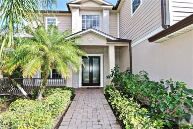 View of front of home featuring a garage and a front lawn