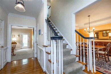 Note the beautiful hardwood floor, dentil molding,