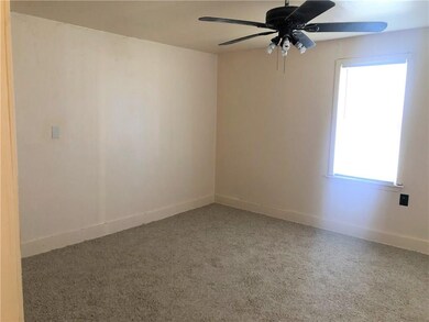 living room, fresh paint and brand new carpet