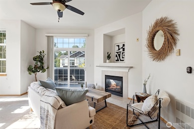Cozy fireplace anchors the living room space
