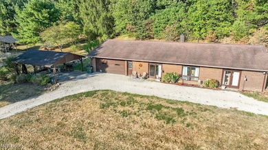 Front view of home with 2 car carport area