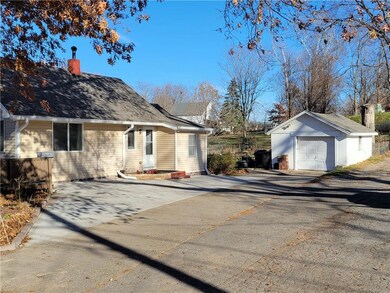 Driveway view with garage