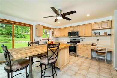 The kitchen has ceramic tile, a center island, map