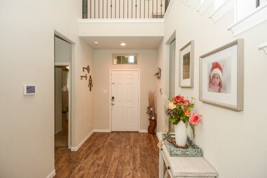 Entry into home you are greeted with oversized foyer