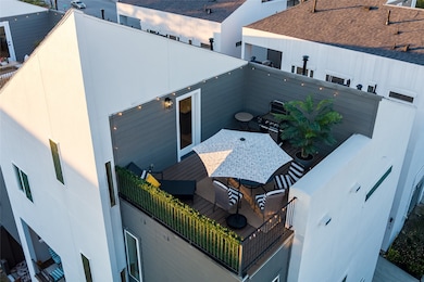 This photo showcases a modern rooftop terrace feat
