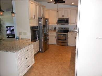 Kitchen with custom cabinets and stainless appliances