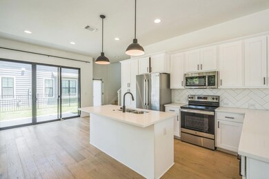 Kitchen featuring appliances with stainless steel
