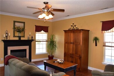 Great room features a gas log fireplace and ceilin