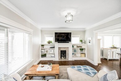 Instagram-worthy, spacious living room with built-ins and fireplace.