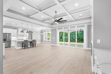 Unfurnished living room featuring light hardwood /