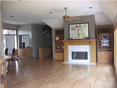 Living room with fireplace and open floor plan wit