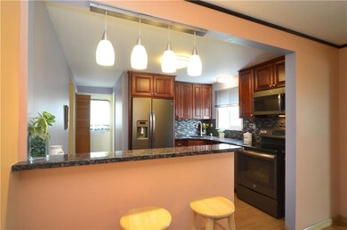 Updated brushed nickel lighting and a breakfast ba