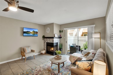 Living area with sliding door to fenced in patio