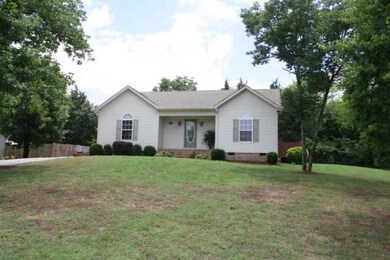 Home sits on a rise with mature trees