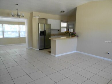 FROM LIVING ROOM TOWARD KITCHEN AND FLORIDA ROOM