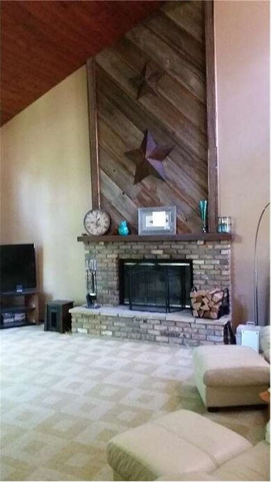 Living room with wood-burning fireplace