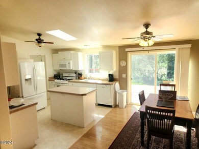 Open concept dining with slider to deck