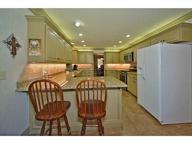 Kitchen. Breakfast bar for quick meals and prep.