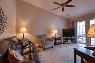 The living room freatures a vaulted ceiling.