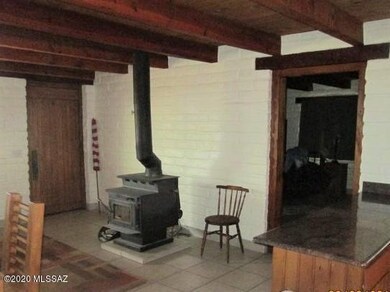 Front door, fireplace & partial kitchen