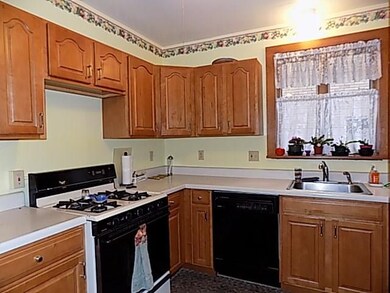 Spotless maple cabinetry in this renovated 12x9 ki