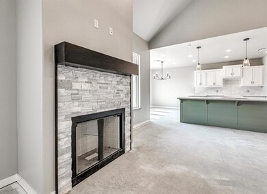 Unfurnished living room with a notable chandelier,