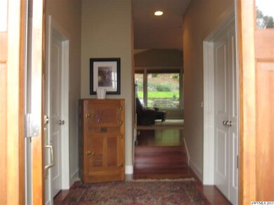 Office/den on the right, powder room on the left a