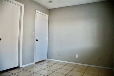  bedroom featuring light tile