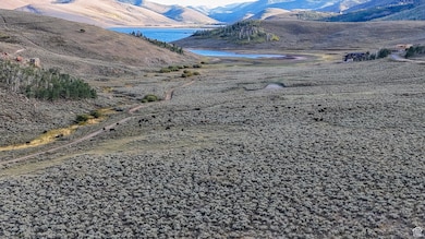 View of mountain backdrop with a large body of water
