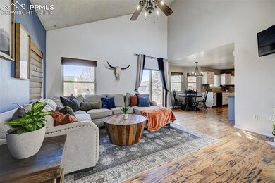 The open floor plan has tons of natural light, wit
