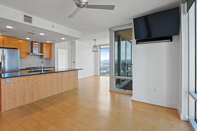 Kitchen featuring wall chimney exhaust hood, a wa