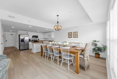 Dining room with visible vents, a chandelier, rece
