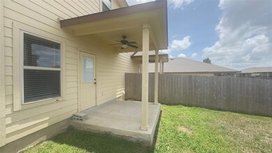 View of yard featuring a ceiling fan