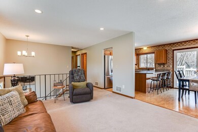 The Living Room opens to the Informal Dining Room and Kitchen.