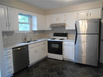 Nice and bright kitchen with new flooring and Cori