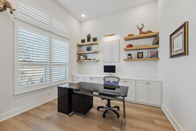 Home office with recessed lighting, baseboards, an