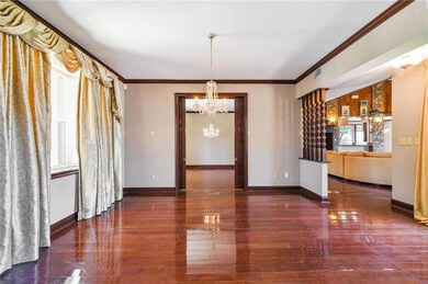 Living room with a view into the dining room.  Poc