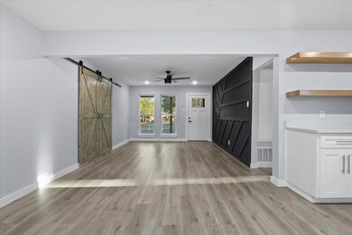 Unfurnished living room featuring light wood-type 