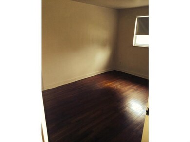 Exterior Front. Bedroom with Hardwood Floors