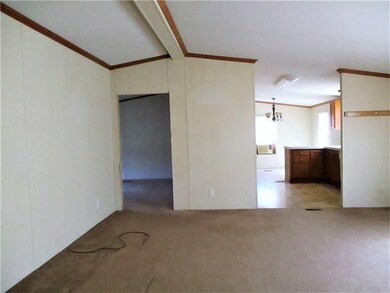 View of living room looking toward kitchen on righ