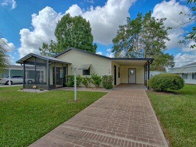 Exterior view showing long PAINTED DRIVEWAY. Home 