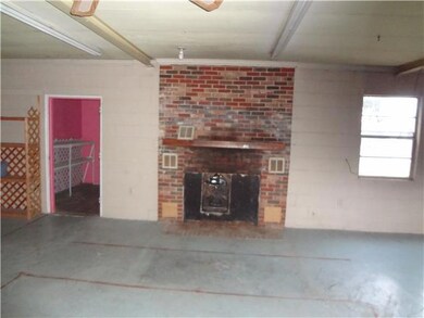 East side of building showing the fireplace or area for area for wood burning stove.
