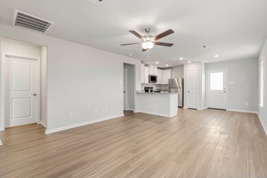 The living room has plenty of space to gather with