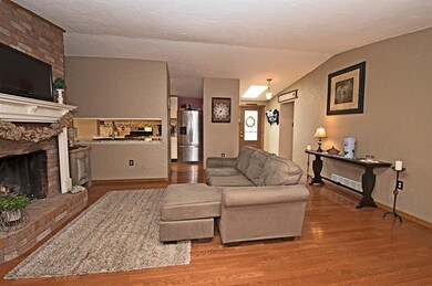COZY UP TO THE FIRE IN THE MAIN LEVEL LIVING ROOM