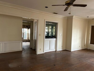 Spare room with crown molding, hardwood / wood-sty