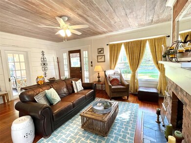 Through the French doors is a flexible space that 