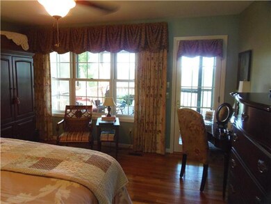 Master bedroom with outside exit to screened porch