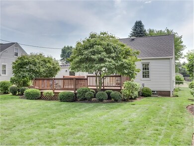 This home's spacious back yard is perfect for a fr