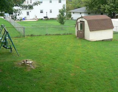 Yard/Garden. fenced in yard with storage shed, ple