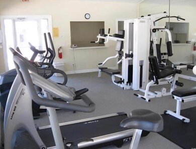 Gym featuring baseboards